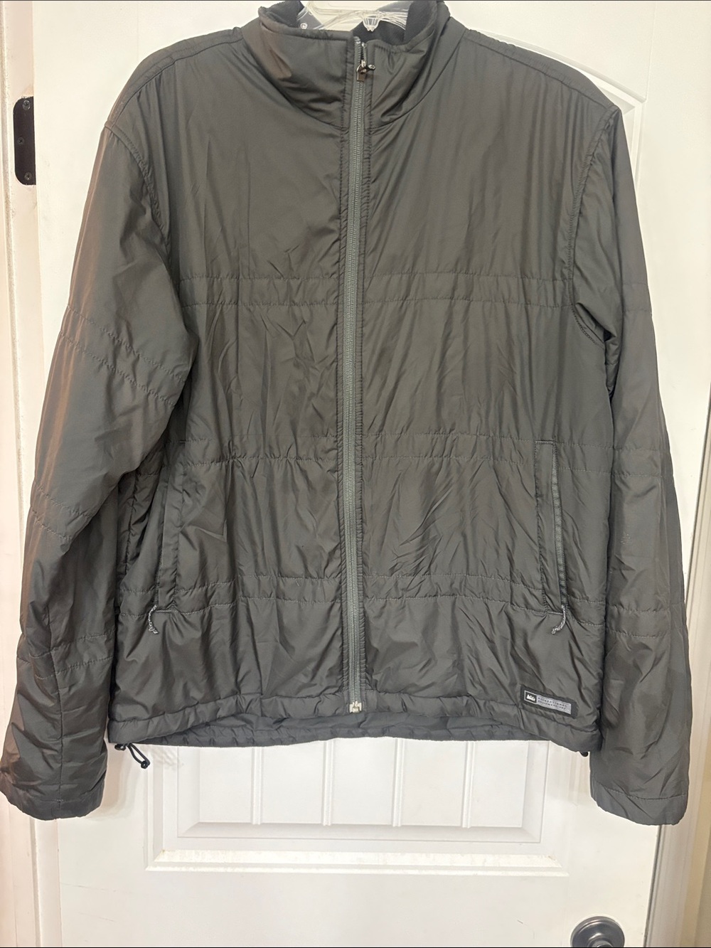 REI Men’s Dark Gray Size Large insulated lightweight rain jacket.